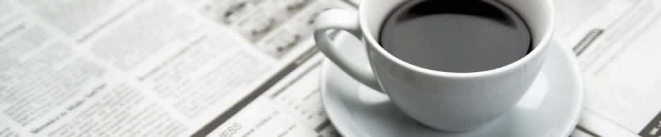 coffee mug on newspaper
