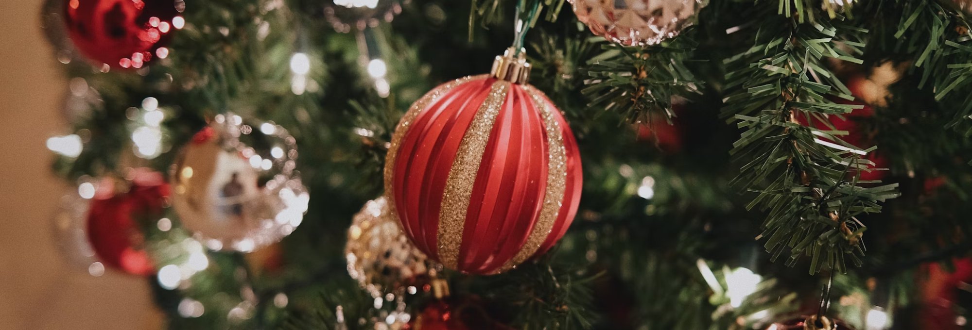 Red Christmas ornaments on a Christmas tree